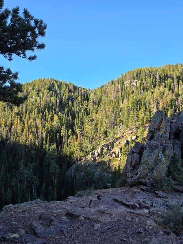 Large boulders overlooking a sunlit mountain valley on Casper Mountain in Wyoming